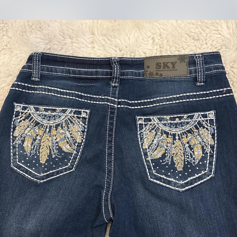 Sky Blue Jeans with Ornate Embellishments